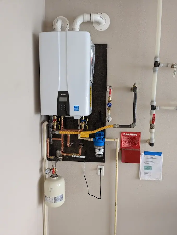 Professional plumber installing copper piping in a Rolla home